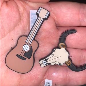 Guitar and Longhorn jibbitz.